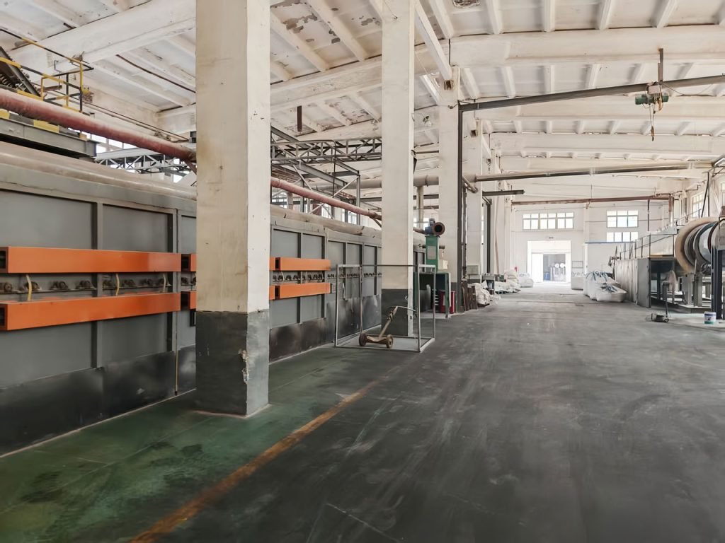 Large black containers in warehouse