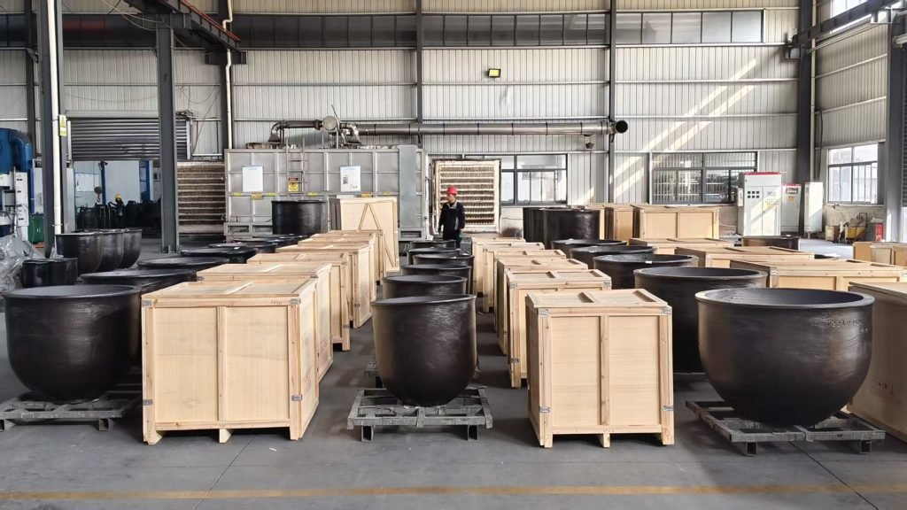 Molten aluminum being poured in foundry production process