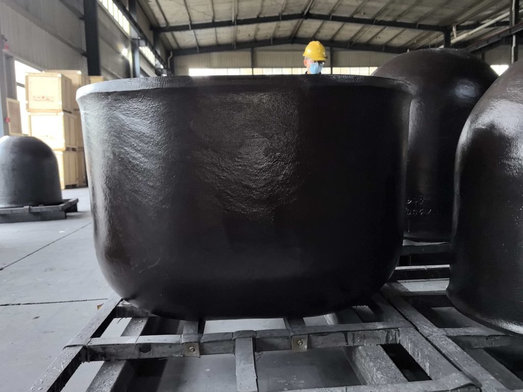 Large black containers in warehouse